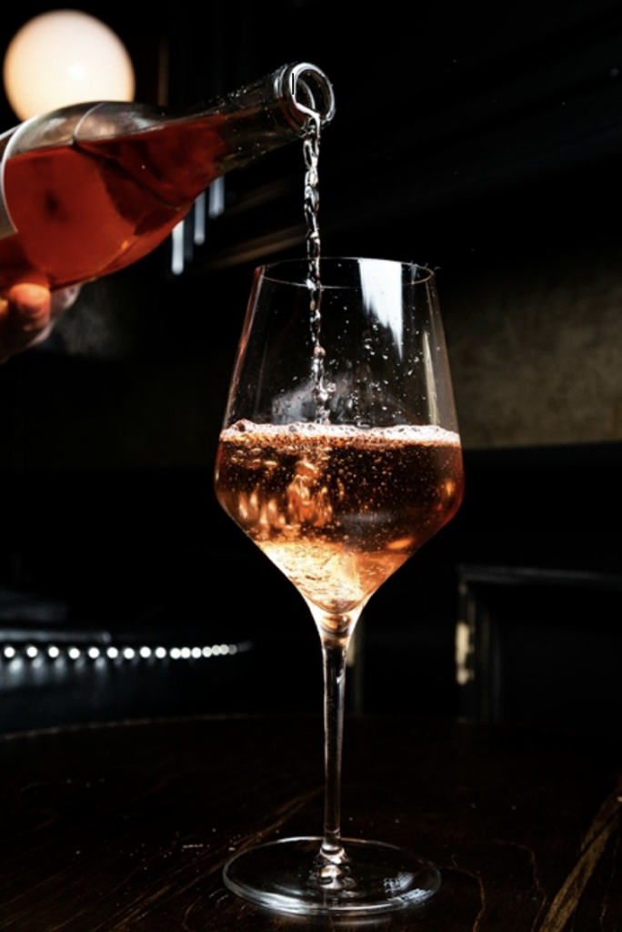 Champagne Poured into Wine Glass